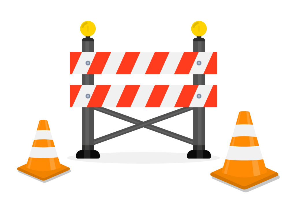 Illustration of a road construction barrier with warning lights and traffic cones, symbolizing a page that is unavailable or under construction (404 error).